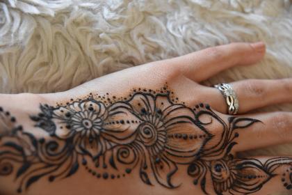 Intricate henna flower and dots